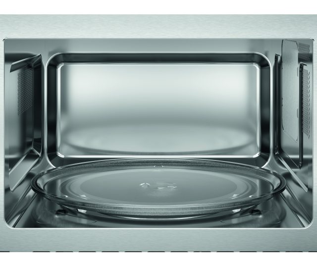 AEG TS5GM25EB inbouw magnetron met grill – vooraanzicht van het lege interieur met glazen draaiplateau op de bodem