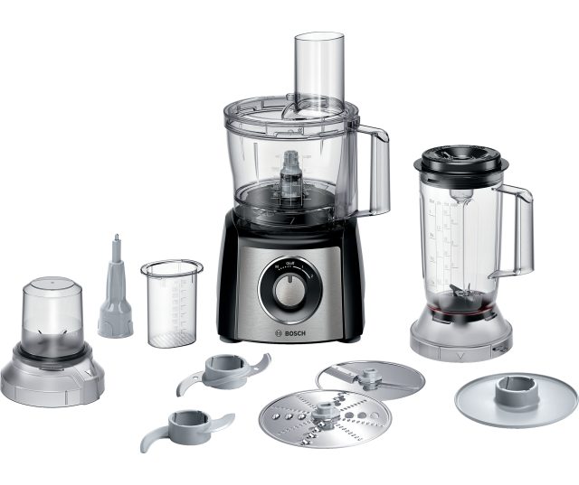 Bosch MCM3PM386 keukenmachine met alle accessoires en onderdelen uitgelegd op wit oppervlak
