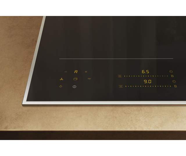Miele KM 8565 FR inductiekookplaat schuin bovenaanzicht met bedieningspaneel en gele displays zichtbaar in werkbladintegratie