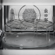 AEG OS5CM34MB inbouw magnetron combi detail deurscharnierzijde met AEG-logo op deur, tijdknop en Stop- en OK-toetsen rechts