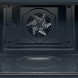 AEG OU5AB40PK compacte oven interieur leeg met rooster en ventilator zichtbaar