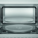 AEG TS5GM25EB inbouw magnetron met grill – vooraanzicht van het lege interieur met glazen draaiplateau op de bodem