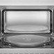 AEG TS5GM25EB inbouw magnetron met grill – binnenruimte met rvs wanden en glazen draaiplateau frontaal gezien