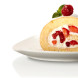 Bosch MFQ2420B handmixer twee mengkloppen en sponge cake met fruit op bord