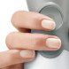 Close-up hand bedient bovenste snelheidsknop van Bosch staafmixer