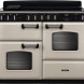 Falcon Classic Deluxe 2026 110 Inductie fornuis vooraanzicht crème met zwart bedieningspaneel en twee ovens