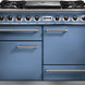 Falcon Deluxe 1092 fornuis blauw metallic, vooraanzicht met tien bedieningsknoppen en drie ovens
