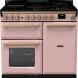 Falcon Estel Deluxe 100 Inductie fornuis vooraanzicht in roze met geopende gasfornuisplaat bovenop
