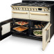 Falcon Estel Deluxe 110 Gas crème fornuis met beide ovendeuren geopend, bakplaten en gerechten