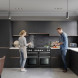 Falcon Nexus SE 110 Gas fornuis ingebouwd in moderne keuken, in gebruik door twee personen