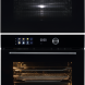 Frilec VESUVIO4550 magnetron en onderste oven in inbouwsituatie met geopende onderoven en verlichte interieur