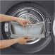 LG RHX5009TBB droger in nis met houten omlijsting en wasmand ernaast