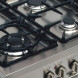 Het kookgedeelte van de M-System MFTD96IX met de wokbrander linksvoor
