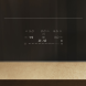 Miele KM 8684 FL inductiekookplaat bedieningspaneel detail met temperatuurinstellingen en timer