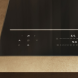 Miele KM 8765 FL inductiekookplaat frontale installatiefoto in keukenwerkblad met zijkant en bedieningspaneel zichtbaar