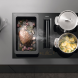 Miele KMDA 7473-1 FL Silence in gebruik met potten en pan, bovenaanzicht in keuken met afzuigingsuitgang zichtbaar
