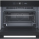 Whirlpool WCW56HMB oven met magnetron, geopende deur met rooster, schappen en interieur zichtbaar