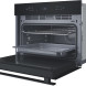 Whirlpool WCW76HTB magnetron combi, zij-perspectief inbouwpositie met geopende deur en aansluiting zichtbaar