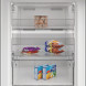 Whirlpool WHMFF 1292 W4E vrieskast vooraanzicht geopende deur toont alle laden inhoud