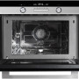 Foto van de binnenzijde van de IMC6144RK combi-magnetron met op de bodem een metalen draaiplateau
